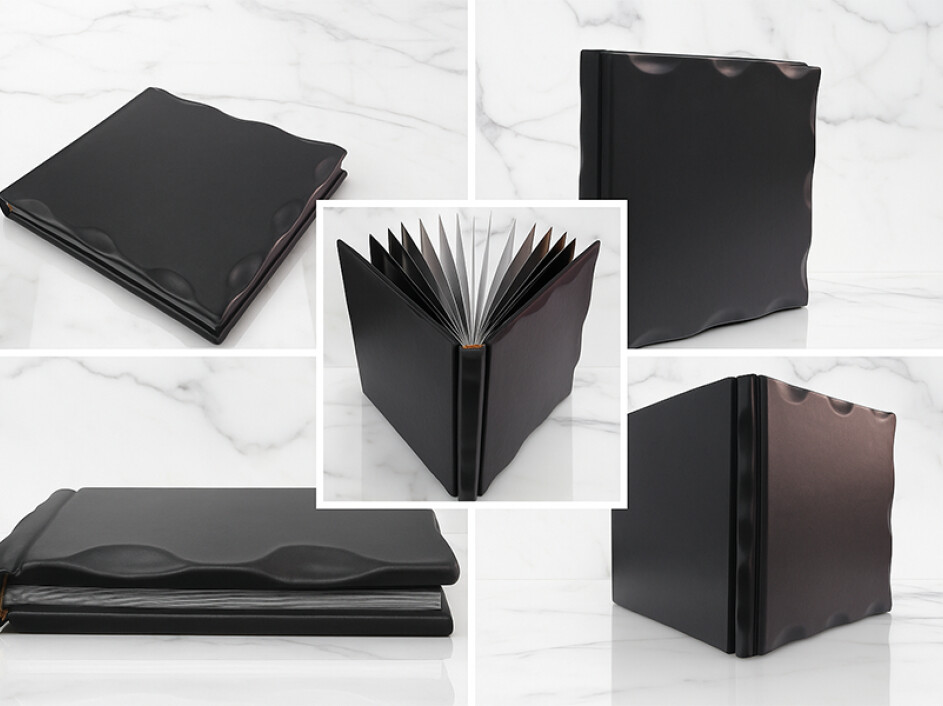 Collage de fotobook clásico rústico Mi Album en color negro, con detalles ondulados en el empastado y acabado elegante sobre fondo de mármol blanco.
